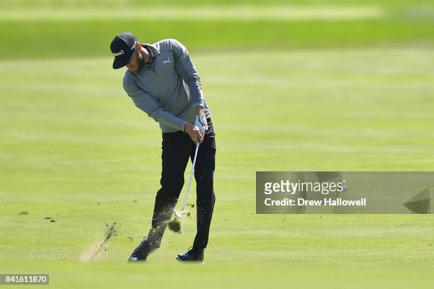 Graham DeLaet of Canada plays a shot on the ninth hole during round one of the Dell Technologies Championship at TPC Boston on September 1, 2017 in...
