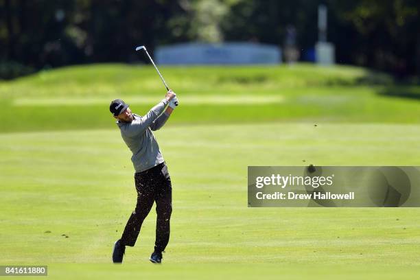 Graham DeLaet of Canada plays a shot on the ninth hole during round one of the Dell Technologies Championship at TPC Boston on September 1, 2017 in...