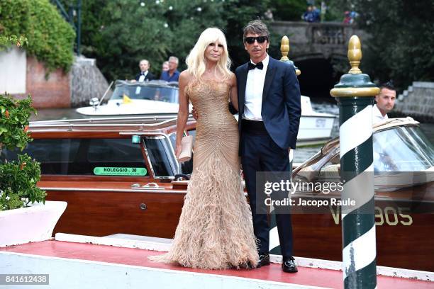 Donatella Versace and Pierpaolo Piccioli are seen during the 74. Venice Film Festival on September 1, 2017 in Venice, Italy.