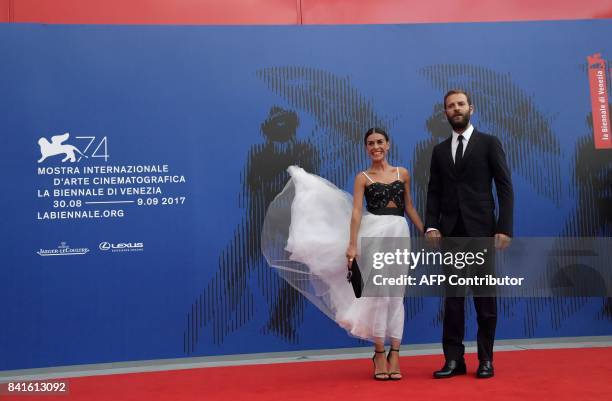 Italian actor Alessandro Borghi and Roberta Pitrone attend the "Franca Sozzani Award" during the 74th Venice Film Festival on September 1, 2017 at...