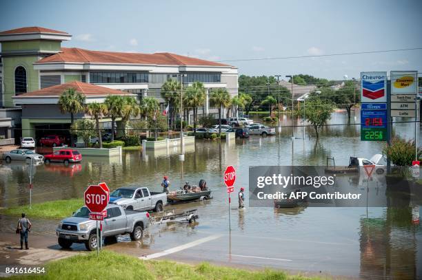 Rescue crews save residents in Port Arthur, Texas on September 1, 2017. Houston was limping back to life on Friday one week after Hurricane Harvey...