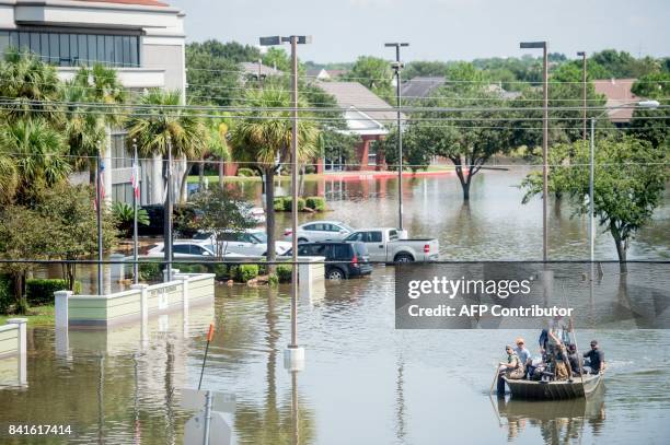 Rescue crews save residents in Port Arthur, Texas on September 1, 2017. Houston was limping back to life on Friday one week after Hurricane Harvey...