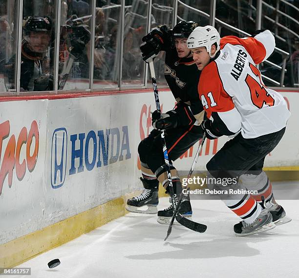 Andrew Alberts of the Philadelphia Flyers battles for the puck against Brendan Morrison of the Anaheim Ducks during the game on January 2, 2009 at...