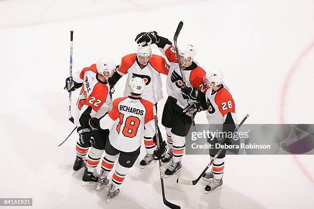 The Philadelphia Flyers celebrate a second period goal from teammate Mike Knuble against the Anaheim Ducks during the game on January 2, 2009 at...