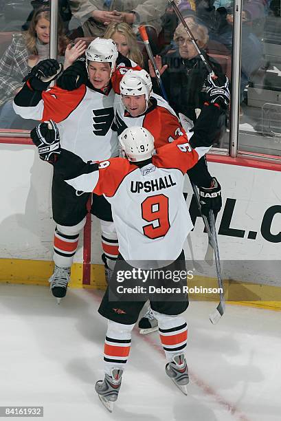 The Philadelphia Flyers celebrate a second period goal from teammate Josh Gratton against the Anaheim Ducks during the game on January 2, 2009 at...