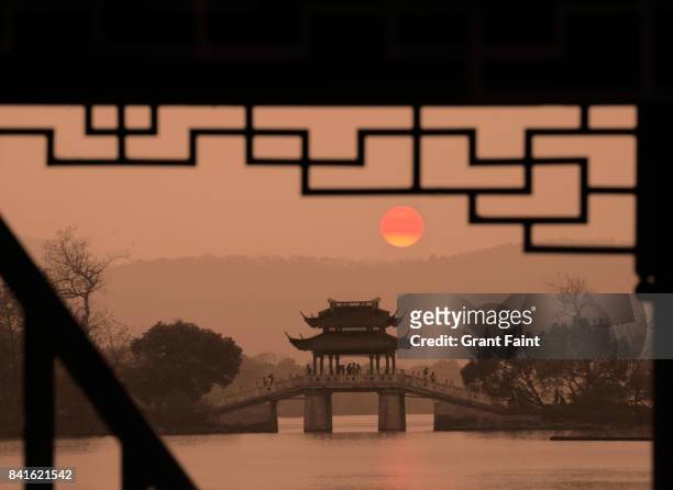 view of sunrise at chinese park. - west lake hangzhou stock pictures, royalty-free photos & images