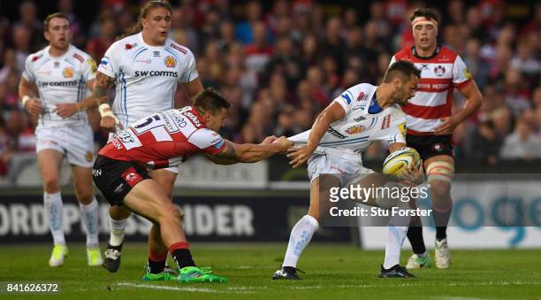 Gloucester fullback Jason Woodward gets to grips with Chiefs player Phil Dollman during the Aviva Premiership match between Gloucester Rugby and...