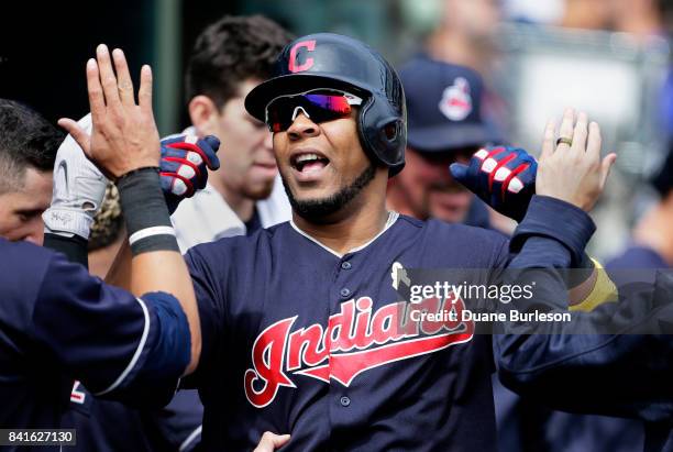 Edwin Encarnacion of the Cleveland Indians celebrates with teammates after hitting a solo home run against the Detroit Tigers during the sixth inning...