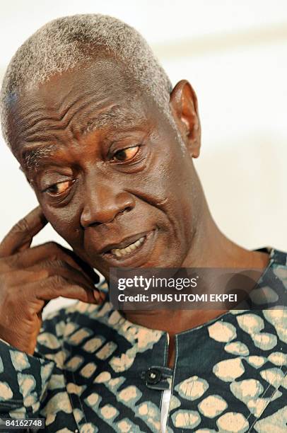 Electoral Commission Chairman Kwadwo Afari-Gyan looks at the script before declaring the presidential candidate of the opposition National Democratic...