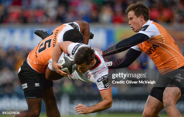 Belfast , United Kingdom - 1 September 2017; Louis Ludik of Ulster is tackled by Sergeal Petersen of Cheetahs during the Guinness PRO14 Round 1 match...