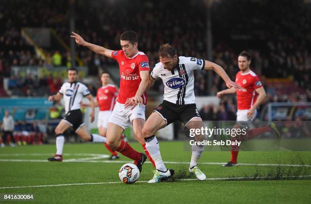 Dundalk , Ireland - 1 September 2017; David McMillan of Dundalk in action against Lee Desmond of St Patricks Athletic during the SSE Airtricity...