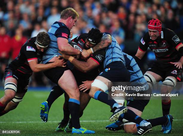 Edinburgh's Darryl Marfo is tackled by Cardiff Blues' Rhys Gill during the Guinness Pro14 Round 1 match between Cardiff Blues and Edinburgh Rugby...