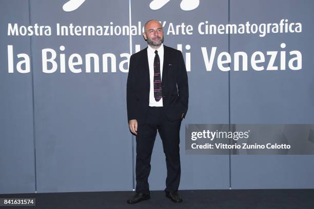 Bruno Oliviero walks the red carpet ahead of the 'Nato A Casal Di Principe' screening during the 74th Venice Film Festival at Sala Giardino on...