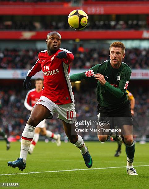 William Gallas of Arsenal clears the ball challenged by Paul Gallagher of Plymouth Argyle during the the FA Cup Sponsored by E.on Third Round match...