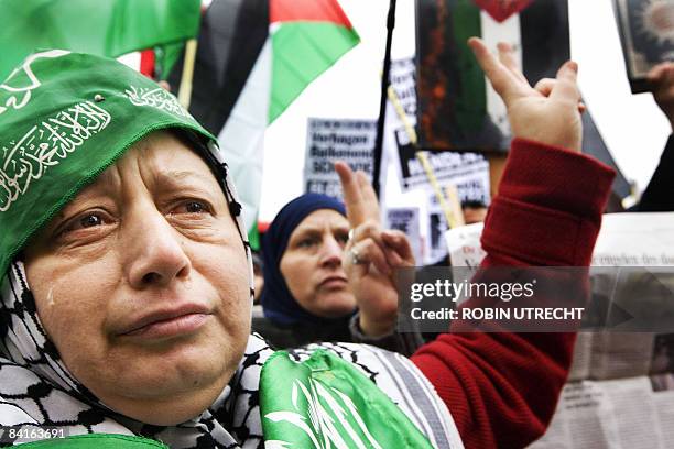 Protester opposed to Israeli military action in the Gaza Strip cries during a demonstration in Amsterdam, on January 3, 2009. Israeli air strikes...