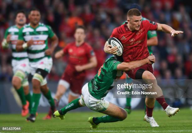 Cork , Ireland - 1 September 2017; Andrew Conway of Munster is tackled by Ian McKinley of Benetton during the Guinness PRO14 Round 1 match between...
