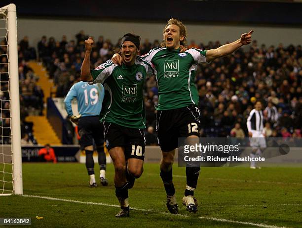 Craig Mackail-Smith of Peterborough celebrates scoring during the the FA Cup Sponsored by E.on third round match between West Bromwich Albion and...