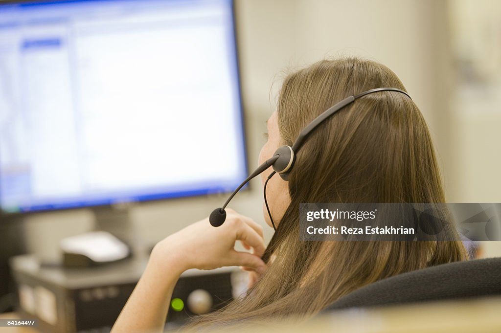 Woman in call center on phone