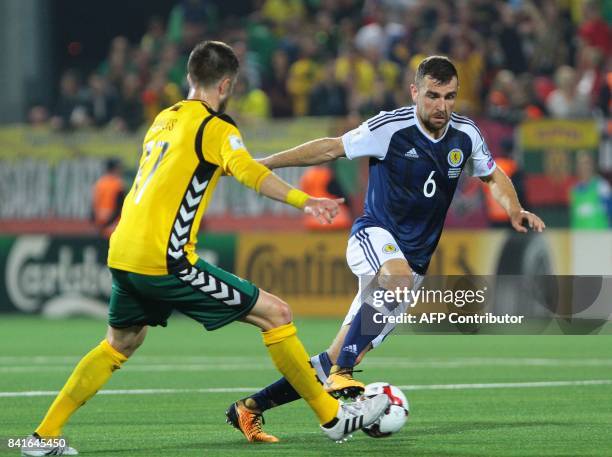 Scotland's James McArthur vies with Lithuania's Mantas Kuklys during the FIFA World Cup 2018 qualification football match between Lithuania and...