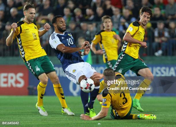 Scotland's Matthew Phillips vies with Lithuania's Arturas Zulpa and Georgas Freidgeimas during the FIFA World Cup 2018 qualification football match...