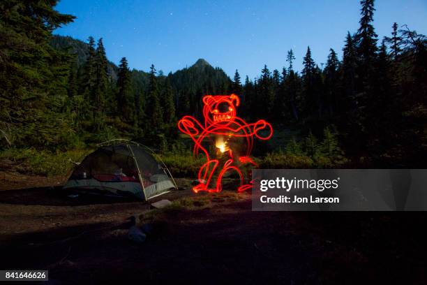 lightpainting at night in camp - light painting stock pictures, royalty-free photos & images