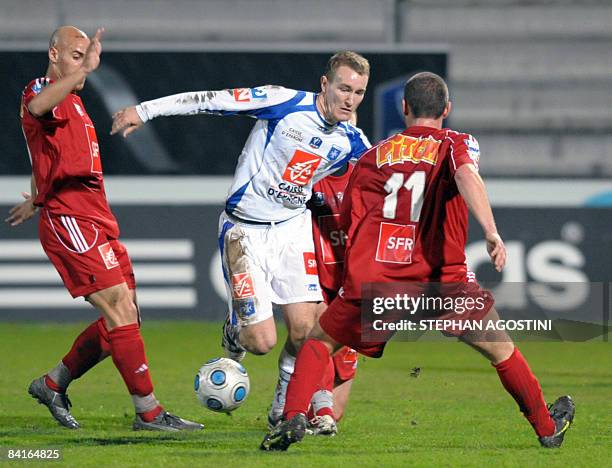 Auxerre's French defender Stephane Grichting vies with Ajaccio's French defender Alain Cantareil during the French cup football match, Ajaccio versus...