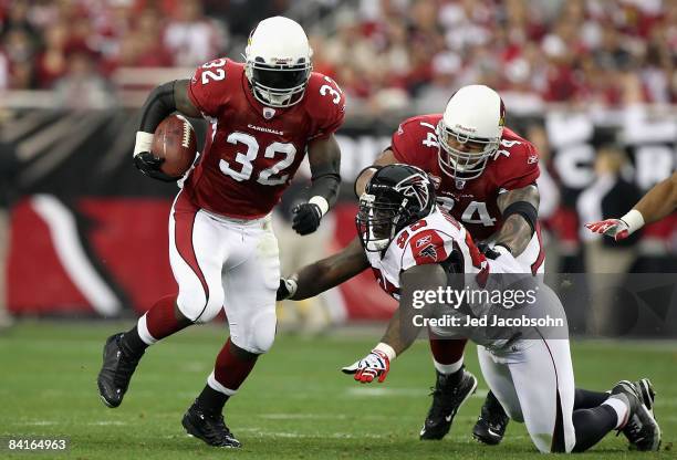 Runningback Edgerrin James of the Arizona Cardinals rushes the ball past Jonathan Babineaux of the Atlanta Falcons during the NFC Wild Card Game on...