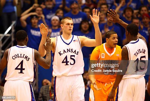 Cole Aldrich of the Kansas Jayhawks is congratulated by teammates after scoring during the game against the Tennessee Volunteers on January 3, 2009...