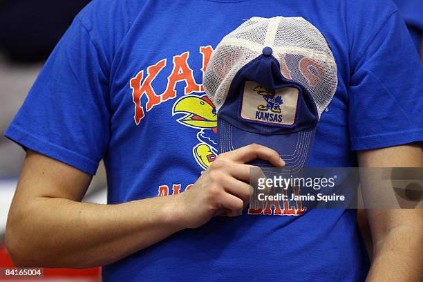 Kansas Jayhawks fan holds his hat over his heart during the playing of the National Anthem prior to the start of the game between the Tennessee...