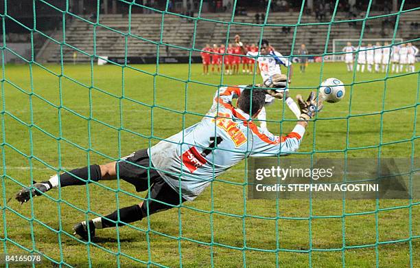 Ajaccio's French gaolkeeper Thierry Debes stops a penalty shot during the French cup football match, Ajaccio versus Auxerre , on January 3 at the...