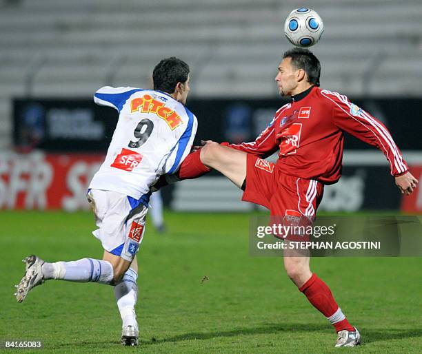 Auxerre's French forward Daniel Niculae vies with Ajaccio's French defender Cedric Uras during the French cup football match, Ajaccio versus Auxerre...