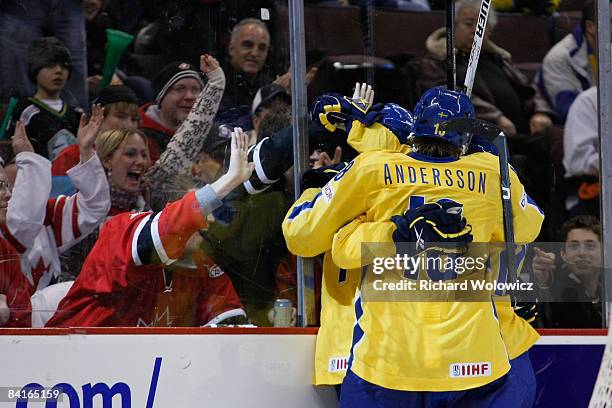 Members of Team Sweden celebrate a third period goal during the game against Team Slovakia at the semifinals at the IIHF World Junior Championships...