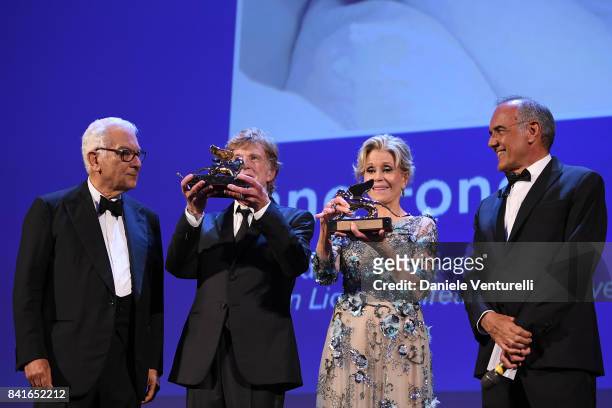 President of the festival Paolo Baratta, Robert Redford, Jane Fonda and director of the festival Alberto Barbera receive a Golden Lion For Lifetime...