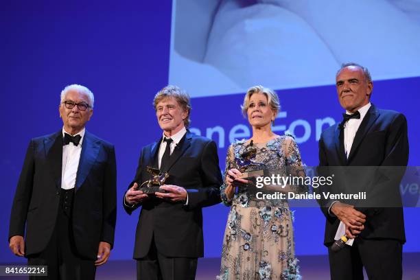 President of the festival Paolo Baratta, Robert Redford, Jane Fonda and director of the festival Alberto Barbera receive a Golden Lion For Lifetime...