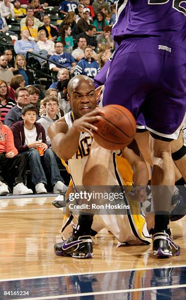 Jarrett Jack of the Indiana Pacers battles for the ball with Brad Miller of the Sacramento Kings at Conseco Fieldhouse on January 3, 2009 in...