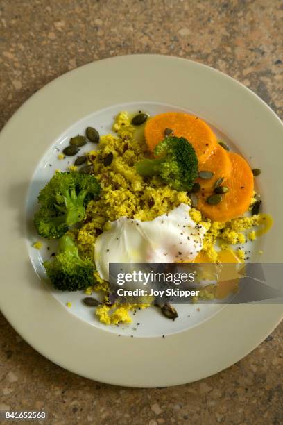 turmeric cauliflower rice with steamed vegetables and poached egg - cauliflower rice stock pictures, royalty-free photos & images