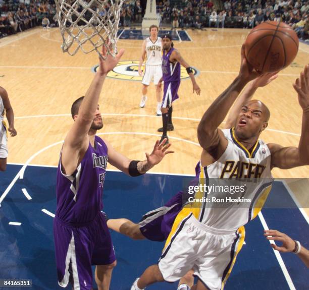 Jarrett Jack of the Indiana Pacers battles Brad Miller of the Sacramento Kings at Conseco Fieldhouse on January 3, 2009 in Indianapolis, Indiana. The...