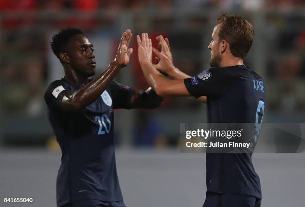 Harry Kane of England celebrates as he scores their fourth goal with Danny Welbeck of England during the FIFA 2018 World Cup Qualifier between Malta...