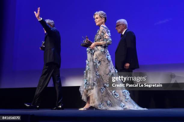 Robert Redford and Jane Fonda receive by President of the festival Paolo Baratta a Golden Lion For Lifetime Achievement Award during the 74th Venice...