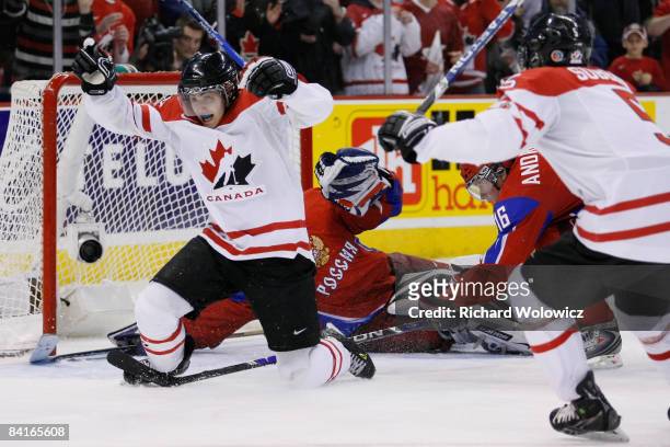 Jordan Eberle of Team Canada reacts after having scored the tying goal on Vadim Zhelobnyuk of Team Russia forcing overtime during the semifinals at...
