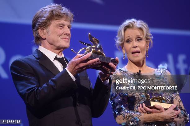 Actors Jane Fonda and Robert Redford receive the Golden Lions For Lifetime Achievement Awards during a ceremony at the 74th Venice Film Festival on...