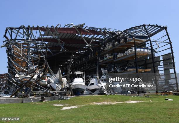 Twisted steel girders in the Cove Harbor Marina boat storage facility show the wind's strength after Hurricane Harvey caused widespread destruction...