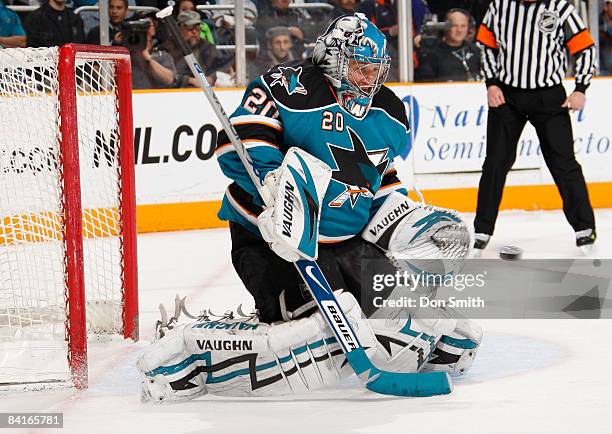 Evgeni Nabokov of the San Jose Sharks gloves a shot flying right towards him during an NHL game against the New York Islanders on January 3, 2009 at...