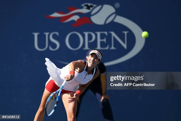 Spain's Garbiñe Muguruza serves the ball to Slovakia's Magdalena Rybarikova during their 2017 US Open Women's Singles match at the USTA Billie Jean...