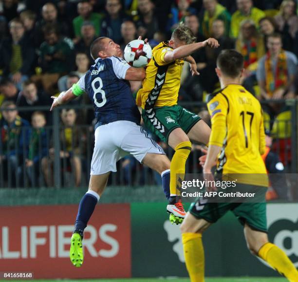 Scotland's Scott Brown vies with Lithuania's Vykintas Slivka during the FIFA World Cup 2018 qualification football match between Lithuania and...