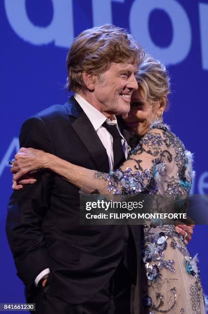 Actors Robert Redford and Jane Fonda receive the Golden Lions For Lifetime Achievement Awards during a ceremony at the 74th Venice Film Festival on...