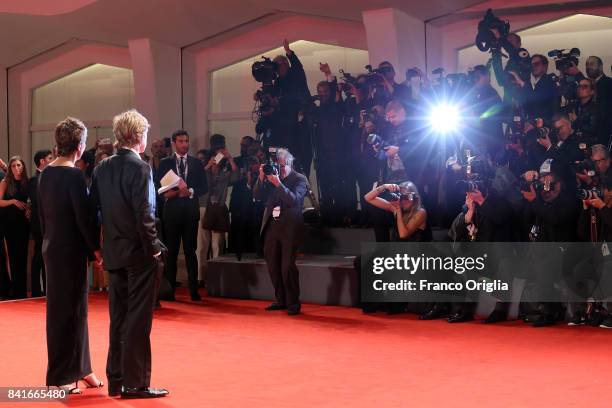 Robert Redford and Sibylle Szaggars walk the red carpet ahead of the 'Our Souls At Night' screening during the 74th Venice Film Festival at Sala...