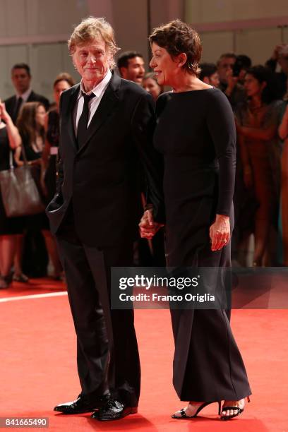 Robert Redford and Sibylle Szaggars walk the red carpet ahead of the 'Our Souls At Night' screening during the 74th Venice Film Festival at Sala...