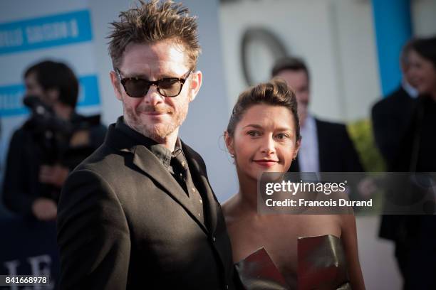 French actress Emma de Caunes and her husband, British cartoonist Jamie Hewlett arrive at the opening ceremony of the 43rd Deauville American Film...