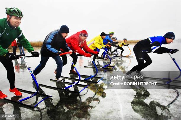 Participants compete during the National step-sledge Championship at Veluwe lake in Elburg, the Netherlands, on January 4, 2009. A step-sledge has...